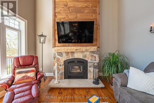25 Hawkins Road, Otonabee-South Monaghan, ON - Indoor Photo Showing Living Room With Fireplace