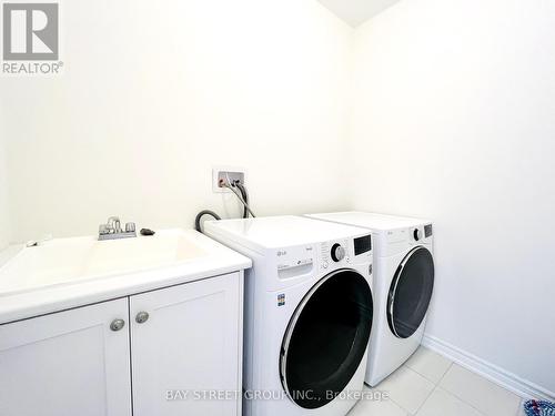 128 Victoria Wood Avenue, Springwater, ON - Indoor Photo Showing Laundry Room
