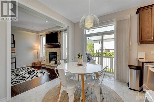 313 Meadowbreeze Drive, Kanata, ON - Indoor Photo Showing Dining Room With Fireplace