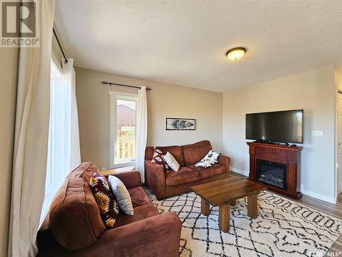 8921 Hunts Cove Crescent, Cochin, SK - Indoor Photo Showing Living Room With Fireplace