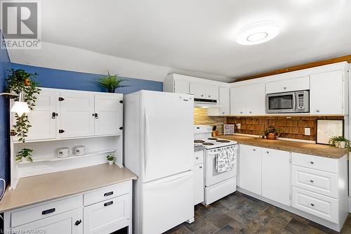 Well appointed kitchen with beautiful stone countertop and under cabinet lighting! - 710 West Road, Northern Bruce Peninsula, ON - Indoor Photo Showing Kitchen