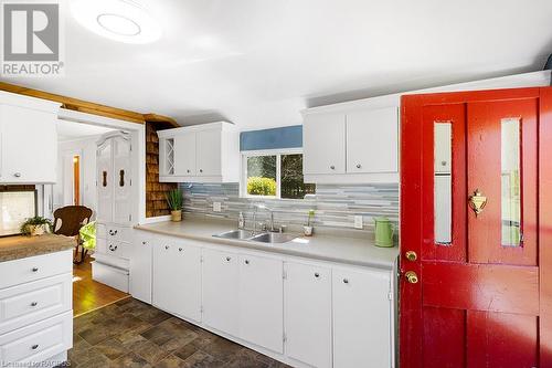 Tons of cabinet space and storage! - 710 West Road, Northern Bruce Peninsula, ON - Indoor Photo Showing Kitchen With Double Sink