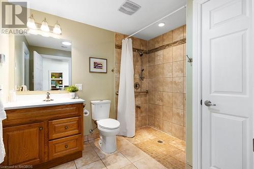 Beautiful bathroom with level entry tiled shower! Also featuring a skydome bringing in natural light from above - 710 West Road, Northern Bruce Peninsula, ON - Indoor Photo Showing Bathroom