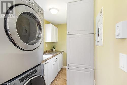 Formal laundry room with deep sink and lots of countertop space! - 710 West Road, Northern Bruce Peninsula, ON - Indoor Photo Showing Laundry Room