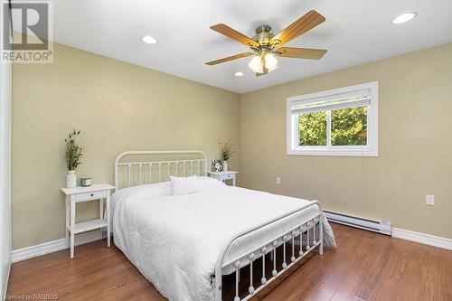 Large primary bedroom with ceiling fan and recessed lighting - 710 West Road, Northern Bruce Peninsula, ON - Indoor Photo Showing Bedroom