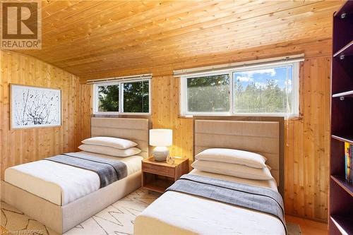 2nd Bedroom *Photo has been virtually staged with kids sized beds (Room is 13ft 4"" by 6ft 8"") - 710 West Road, Northern Bruce Peninsula, ON - Indoor Photo Showing Bedroom