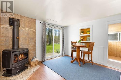 Step out the patio door into your large open grass space! - 710 West Road, Northern Bruce Peninsula, ON - Indoor With Fireplace