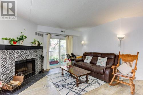 26 - 3085 Kingsway Drive, Kitchener, ON - Indoor Photo Showing Living Room With Fireplace