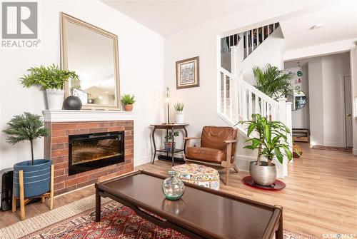 226 Schmeiser Bend, Saskatoon, SK - Indoor Photo Showing Living Room With Fireplace