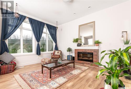 226 Schmeiser Bend, Saskatoon, SK - Indoor Photo Showing Living Room With Fireplace