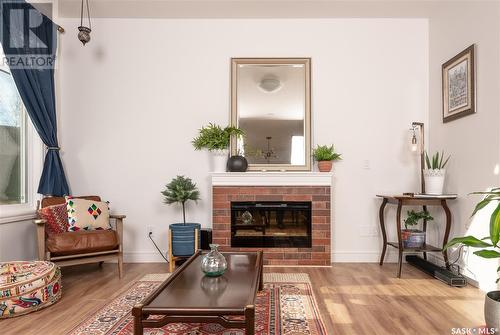 226 Schmeiser Bend, Saskatoon, SK - Indoor Photo Showing Living Room With Fireplace