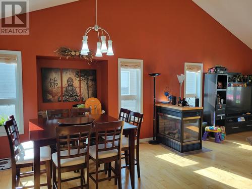 780 Sandy Beach Road, Vanderhoof, BC - Indoor Photo Showing Dining Room With Fireplace