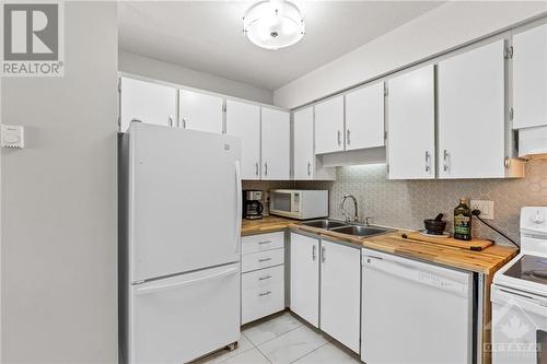 Matching Appliances, Modern Tile Floor and Backsplash - 2927 Fairlea Crescent, Ottawa, ON - Indoor Photo Showing Kitchen With Double Sink