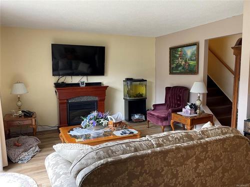407 Haida Ave, Port Alice, BC - Indoor Photo Showing Living Room With Fireplace