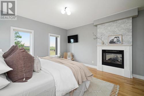 1065 Concession 3 Road, Niagara-On-The-Lake, ON - Indoor Photo Showing Bedroom With Fireplace