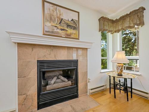 301-1500 Elford St, Victoria, BC - Indoor Photo Showing Living Room With Fireplace