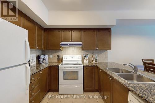 103 - 9901 Keele Street, Vaughan, ON - Indoor Photo Showing Kitchen With Double Sink