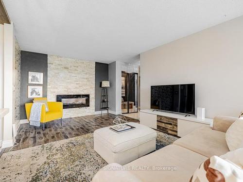 505-60 Pavane Linkway, Toronto, ON - Indoor Photo Showing Living Room With Fireplace