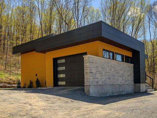 Garage - 200 Allée Des Weskarinis, Mont-Tremblant, QC - Outdoor With Exterior