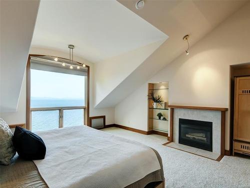 2588 Seaside Dr, Sooke, BC - Indoor Photo Showing Bedroom With Fireplace