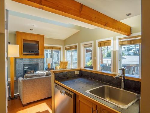 33-1431 Pacific Rim Hwy, Tofino, BC - Indoor Photo Showing Kitchen With Fireplace