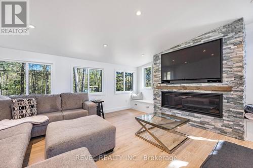 68 Bellehumeur Road, Tiny, ON - Indoor Photo Showing Living Room With Fireplace
