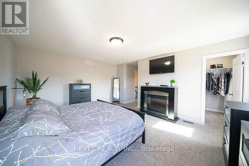 67 Curtis Street, East Zorra-Tavistock, ON - Indoor Photo Showing Bedroom With Fireplace