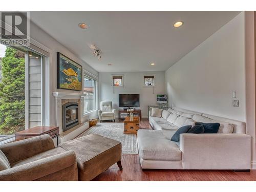 5254 Cobble Crescent, Kelowna, BC - Indoor Photo Showing Living Room With Fireplace