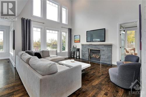6900 Lakes Park Drive, Greely, ON - Indoor Photo Showing Living Room With Fireplace