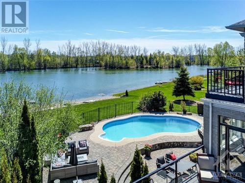 6900 Lakes Park Drive, Greely, ON - Outdoor With Body Of Water With In Ground Pool With Deck Patio Veranda With View