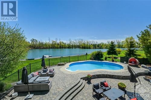 6900 Lakes Park Drive, Greely, ON - Outdoor With Body Of Water With In Ground Pool With Deck Patio Veranda With Backyard
