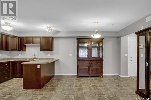 106 215 Smith Street N, Regina, SK - Indoor Photo Showing Kitchen With Double Sink