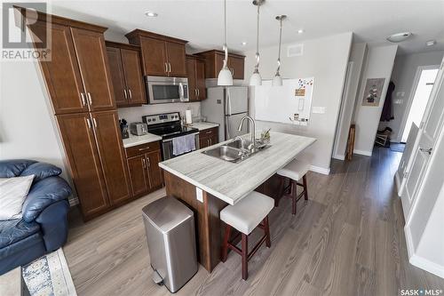 123 Plains Circle, Pilot Butte, SK - Indoor Photo Showing Kitchen With Double Sink With Upgraded Kitchen