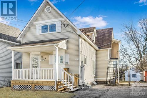 Well maintained duplex with separate entrances in growing Rockland...notice the wide parking and the newer windows. - 927-931 Laurier Street, Rockland, ON - Outdoor With Deck Patio Veranda With Facade