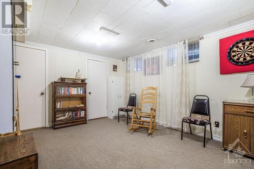 This spacious room off the family room could have many uses like hobby room, playroom or den. The 2 doors at the far end are to access a cedar closet. Behind the photographer there is also a huge - 927-931 Laurier Street, Rockland, ON - Indoor Photo Showing Other Room