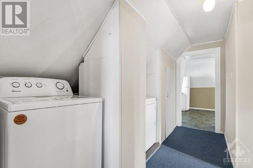 In the hallway to the bedroom area you will discover a new full size washer and dryer. - 927-931 Laurier Street, Rockland, ON - Indoor Photo Showing Laundry Room