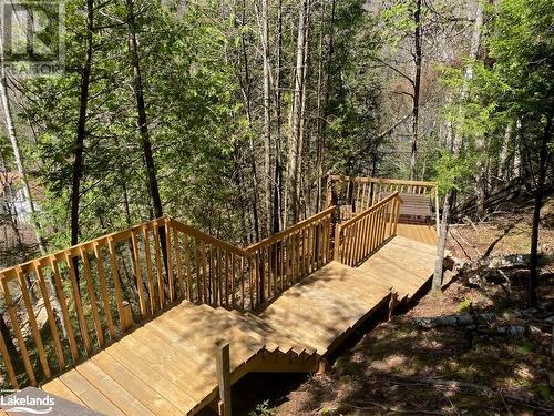 Stairs and Decking down to water - 1275 Precipice Road, Haliburton, ON - Outdoor With Deck Patio Veranda