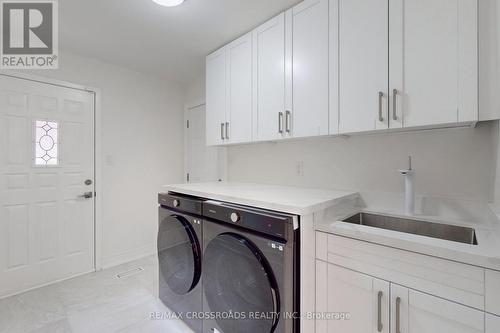 128 Abbeywood Trail, Toronto, ON - Indoor Photo Showing Laundry Room