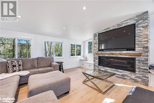 68 Bellehumeur Road, Tiny, ON - Indoor Photo Showing Living Room With Fireplace