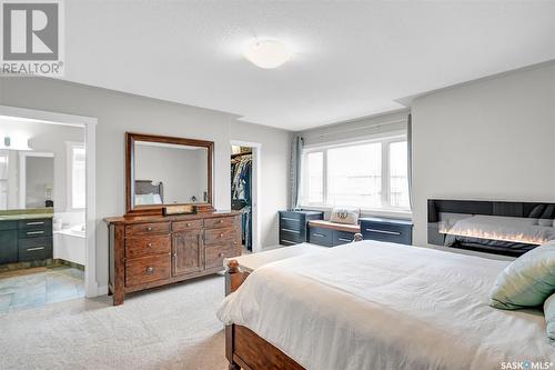 4107 Cumberland Road E, Regina, SK - Indoor Photo Showing Bedroom With Fireplace
