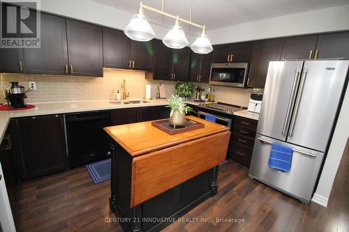 7 - 51 Hays Boulevard, Oakville, ON - Indoor Photo Showing Kitchen With Double Sink