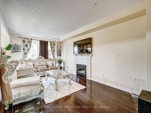 15 Yardmaster Dr, Brampton, ON - Indoor Photo Showing Living Room With Fireplace