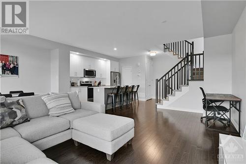 lovely 2nd floor with comfortable and flexible living room and dining room space, kitchen island and breakfast bar, walk in pantry - 800 Cap Diamant Way, Ottawa, ON - Indoor Photo Showing Living Room