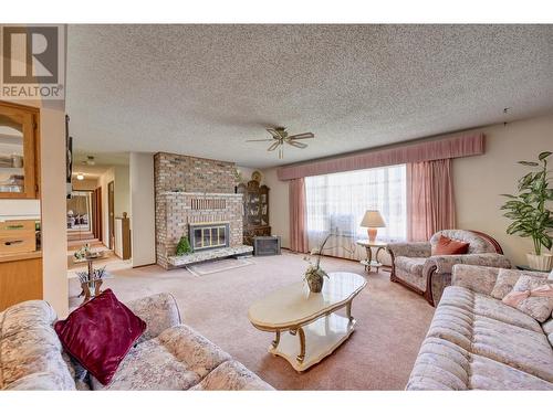 321 Road 9, Oliver, BC - Indoor Photo Showing Living Room With Fireplace