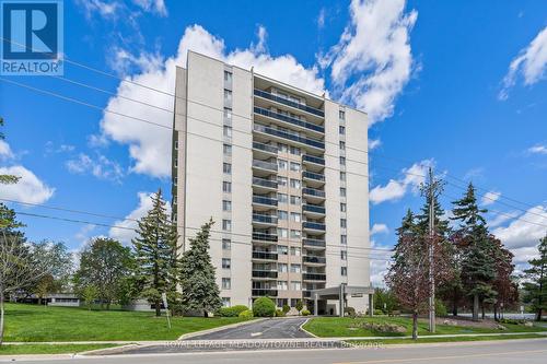 802 - 81 Millside Drive, Milton, ON - Outdoor With Balcony With Facade