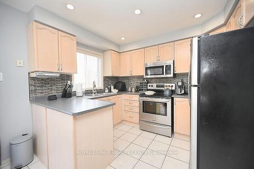 3 Lake Louise Dr, Brampton, ON - Indoor Photo Showing Kitchen With Double Sink
