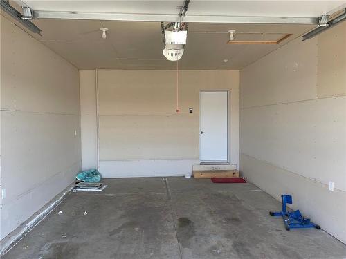 61 Boschman Bay, Brandon, MB - Indoor Photo Showing Garage