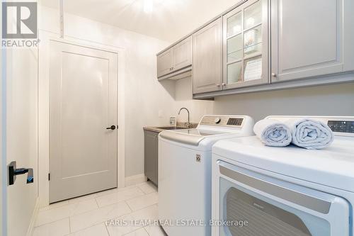 1402 Flos Road 8 E, Springwater, ON - Indoor Photo Showing Laundry Room