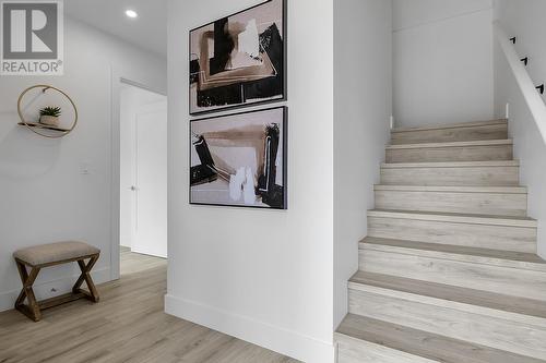 Hallway leading to Stairs - Photo of a similar home in the community. - 1455 Cara Glen Court Unit# 103, Kelowna, BC - Indoor Photo Showing Other Room