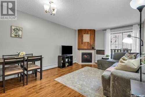 105G 1121 Mckercher Drive, Saskatoon, SK - Indoor Photo Showing Living Room With Fireplace